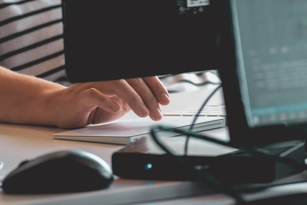 A person is typing on the keyboard