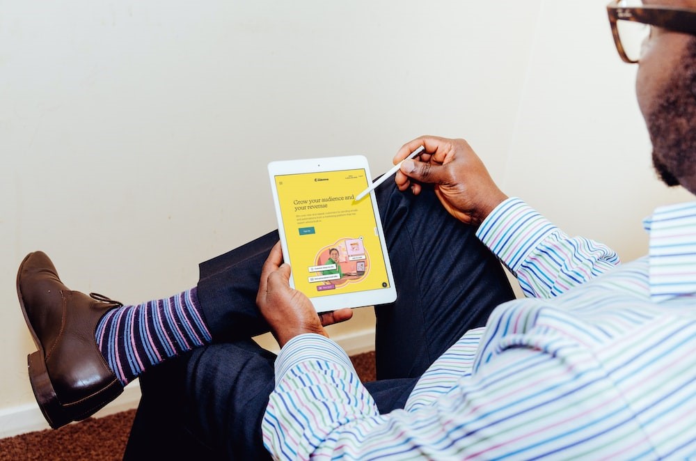 A man is using ipad